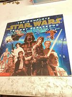 Front cover showing title, Star Wars character collage, Scholastic logo