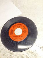 A-side showing Columbia orange label text "Flowers on the Wall" and catalog number