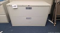 Front view of 2-drawer metal file cabinet