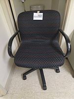 Front view of task chair showing fabric pattern, armrests, base
