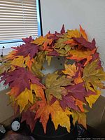 Autumn leaf wreath on top of box