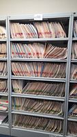 Front view showing six shelves filled with folders