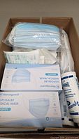 Box with Norcoguard mask boxes, loose masks, sealed tubing sets, disinfectant wipes
