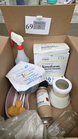 Overall contents in cardboard box: Xeroform dressing boxes, mask, spray bottle, oral swabs, aerosol can, jar