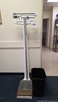 Full view of beam scale and trash can