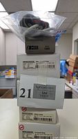 Stack of boxed McKesson and Baumanometer items with loose cuff on top