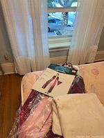 Packaged costume gown, product card, folded white cloth