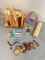 Full lot showing Indian corn, ribbon coil, burlap roll, scarecrow, glitter vials, Parowax box, wood slice and scattered potpourri pieces