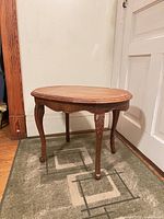 Full view of oval wood end table