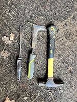 three hand tools laid out showing overall condition and size comparison