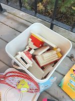 Bucket containing LEGO fire station bricks