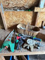 Group view of sprinklers, nozzles and basket on workbench
