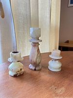Front view of all three onyx candlestick holders