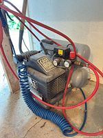 Full view of compressor with hoses attached