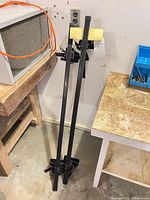 pair of crossbars standing upright showing full length and general condition