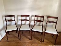Front view of all four matching chairs lined up