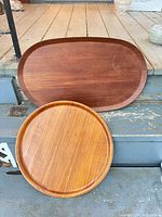 Round and oval teak trays front view