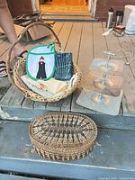 Group shot of all items: both baskets, linens, pot holder, disassembled three-tier tray