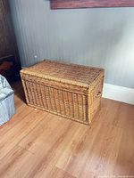 Closed wicker storage trunk front and side view