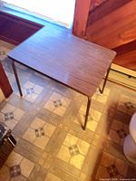 Top view of rectangular wood veneer side table with metal legs