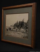Angled view of framed black-and-white rural scene photograph in wood frame