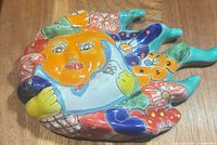 Front view of multicolor Talavera ceramic sun and moon plaque