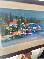 Close-up of central image showing sailboats, cottages and color detail