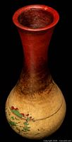Overhead view of vintage vase showing deep red flared rim and gradient neck
