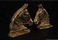 Front angled view of both brass horse head bookends