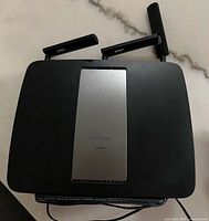Top view showing Linksys logo, model EA9200 and three antennas