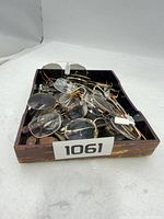 Tray containing mixed eyeglass frames, front view