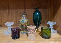 Group shot of all seven decorative pieces on shelf