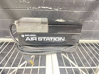 Side view showing Black & Decker Air Station branding, attached power cord