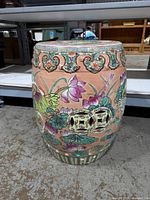 Front view of porcelain barrel garden stool showing floral and bird decoration