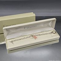 Bracelet displayed in open Crescent box with outer sleeve visible