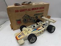 Porcelain race car decanter front three-quarter with original box