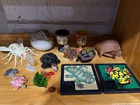 Shelf view showing assortment of figurines and miniatures