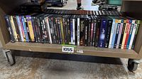 Full shelf showing all DVD spines, approx. 46 items