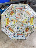 Novelty comic-strip print umbrella canopy