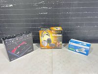 All three boxed items side by side