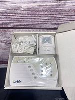 Open kit showing control panel, motion sensor and hardware