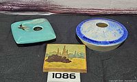 All three items: square turquoise flower frog, round blue crystalline flower frog, square landscape tile