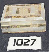 Front angled view of mother-of-pearl and abalone inlay jewelry box