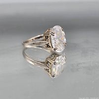 Side view of sterling silver ring showing cubic zirconia and prong setting