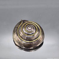 Front view showing spiral design and gold accent