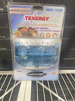 Front view of sealed Tenergy T-2299 charger package with car adapter