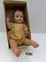 Doll in box, full view with lot number tag