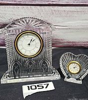 Both Waterford crystal clocks front view with lot tag