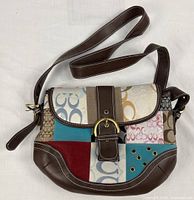 Full view of Coach patchwork flap bag with adjustable strap