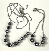 Necklace and bracelet laid out showing overall design and bead graduation
